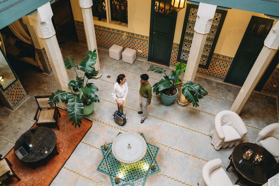 Hotel lobby with plants and warm lighting